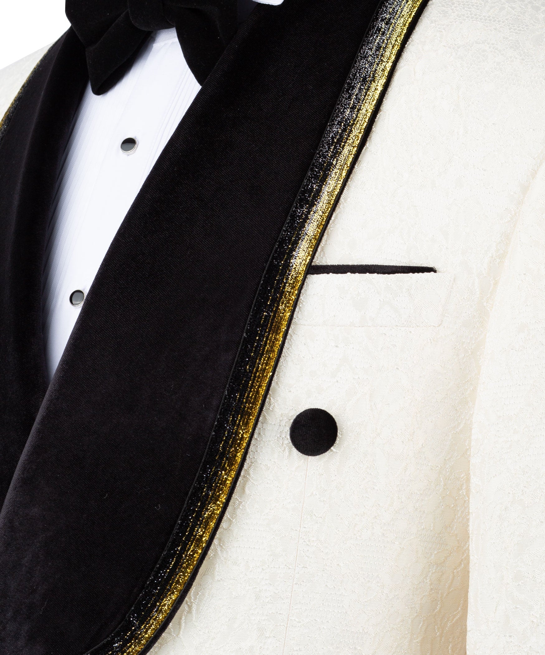 Close-up of black velvet tux lapel with gold-embroidered edge and ivory jacket buttons