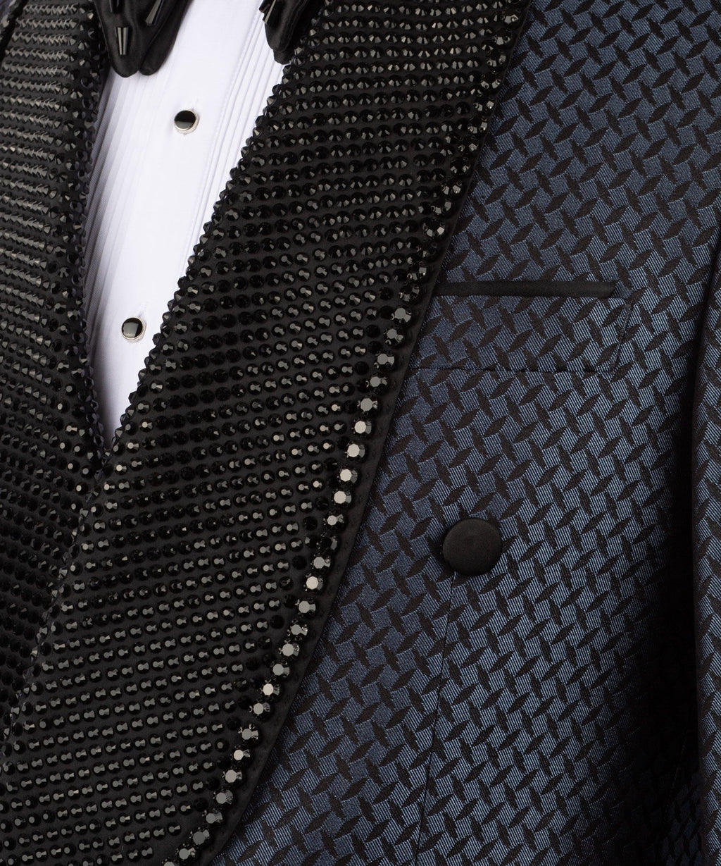 Close-up of black beaded embroidery on tuxedo lapel over white shirt placket