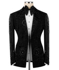 Black tuxedo jacket front with embroidered panels, peaked lapels, and bow tie