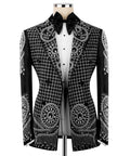Black tuxedo jacket with silver embroidery over white shirt front and black bow tie