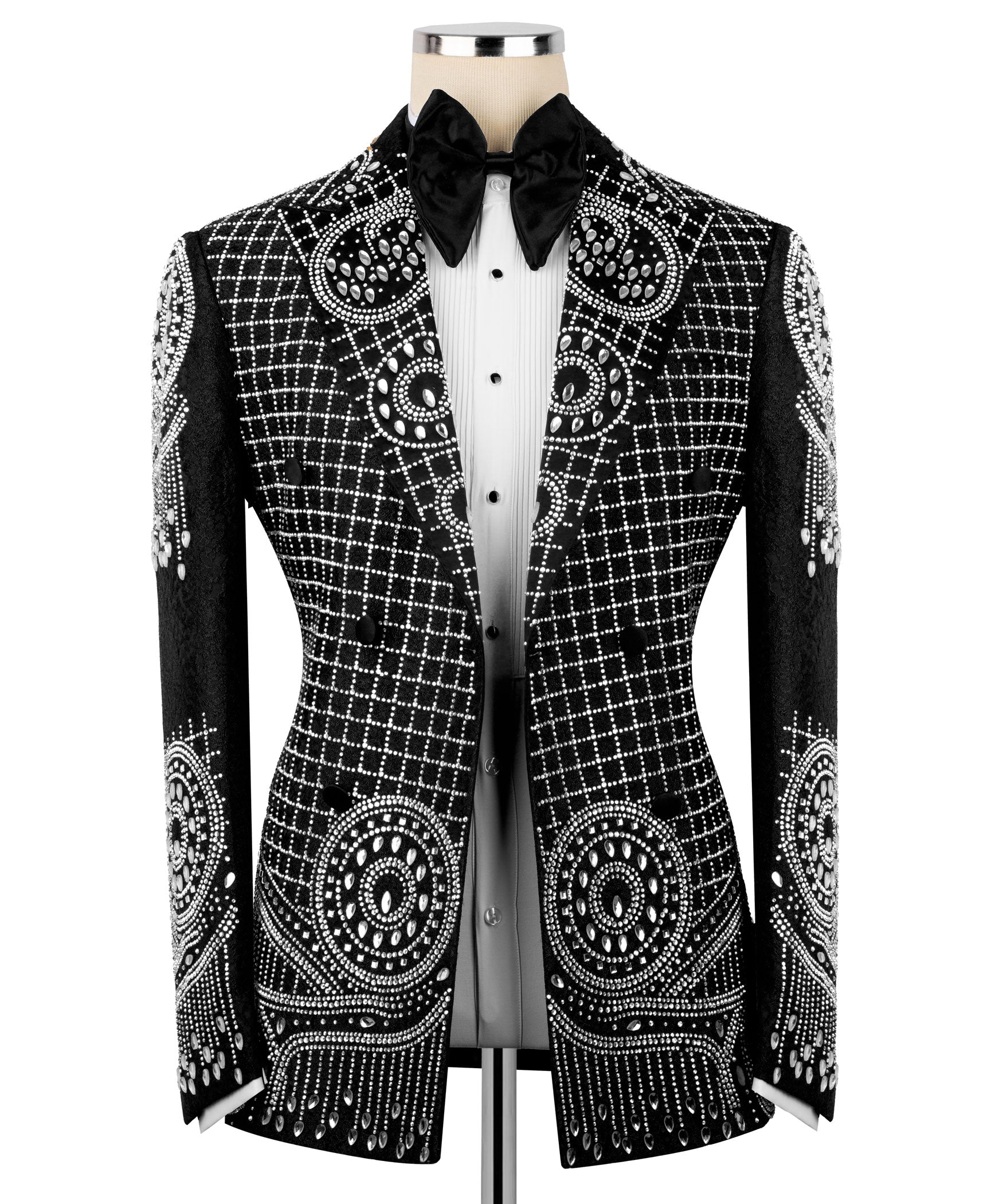 Black tuxedo jacket with silver embroidery over white shirt front and black bow tie