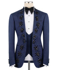 Hand-embroidered navy tuxedo jacket with black jeweled floral trim, white shirt and vest