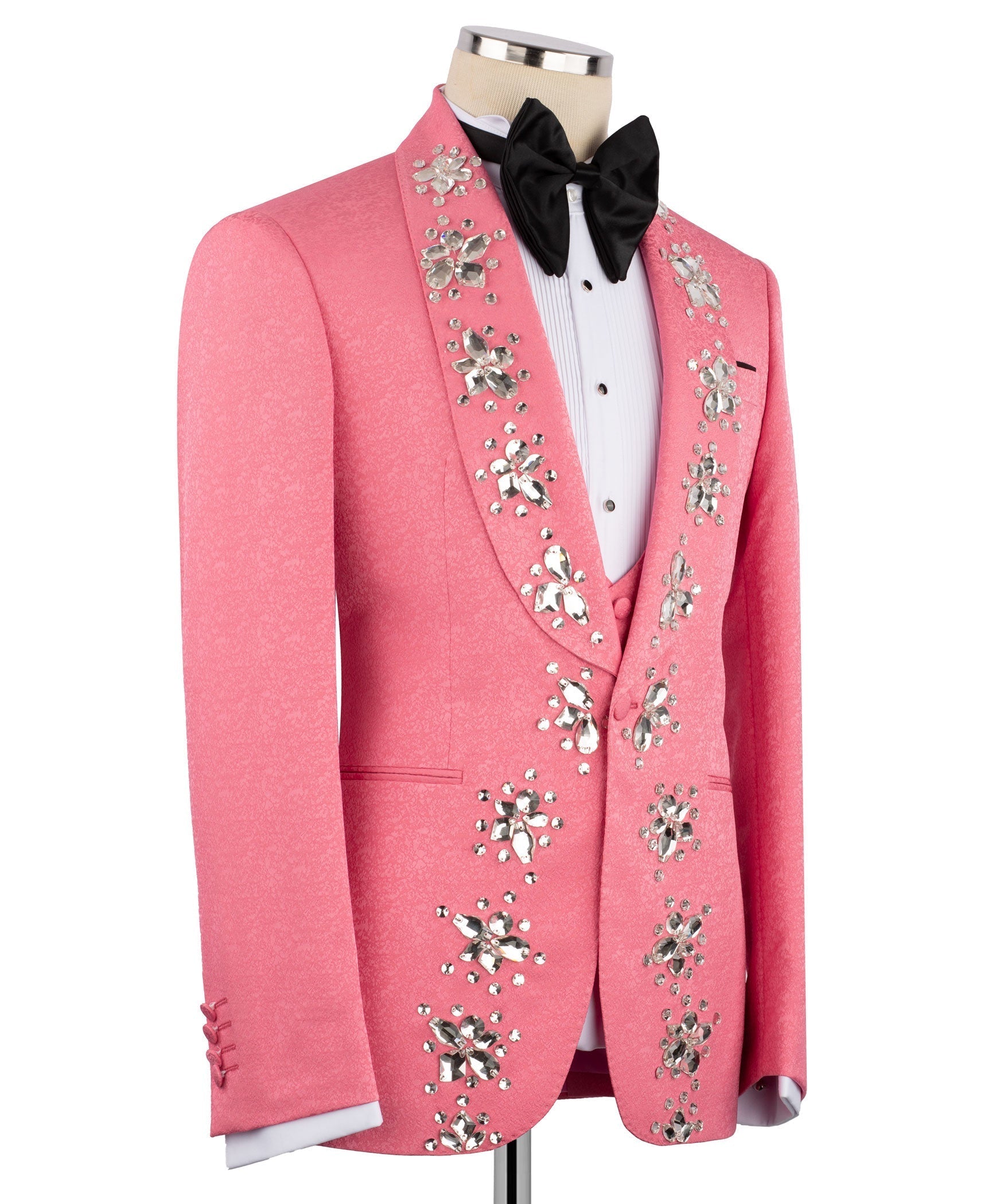 Pink tuxedo jacket side view with crystal embroidery, black bow tie, white vest
