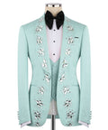 Teal tuxedo jacket with silver stone embroidery and black satin bow tie