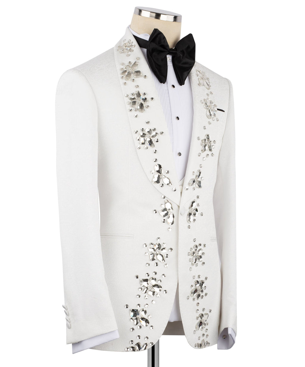 White tuxedo jacket with hand-embroidered jeweled panels and black bow tie