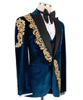 Front view: dark blue velvet tuxedo jacket, gold ornate trim on shoulders and sleeves, vest