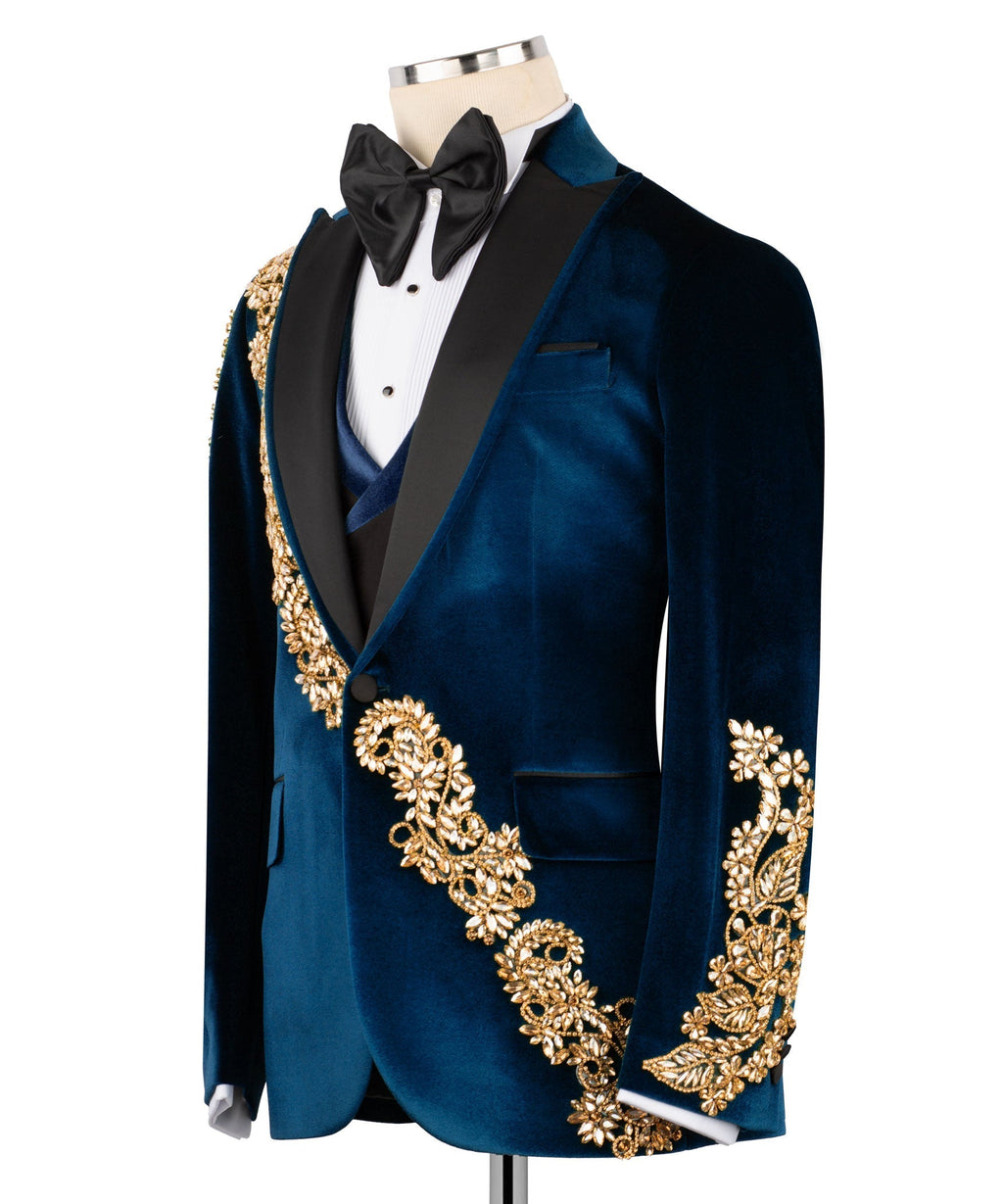 Dark blue velvet tuxedo jacket with gold embroidered fringe along V-front and cuffs, bow tie