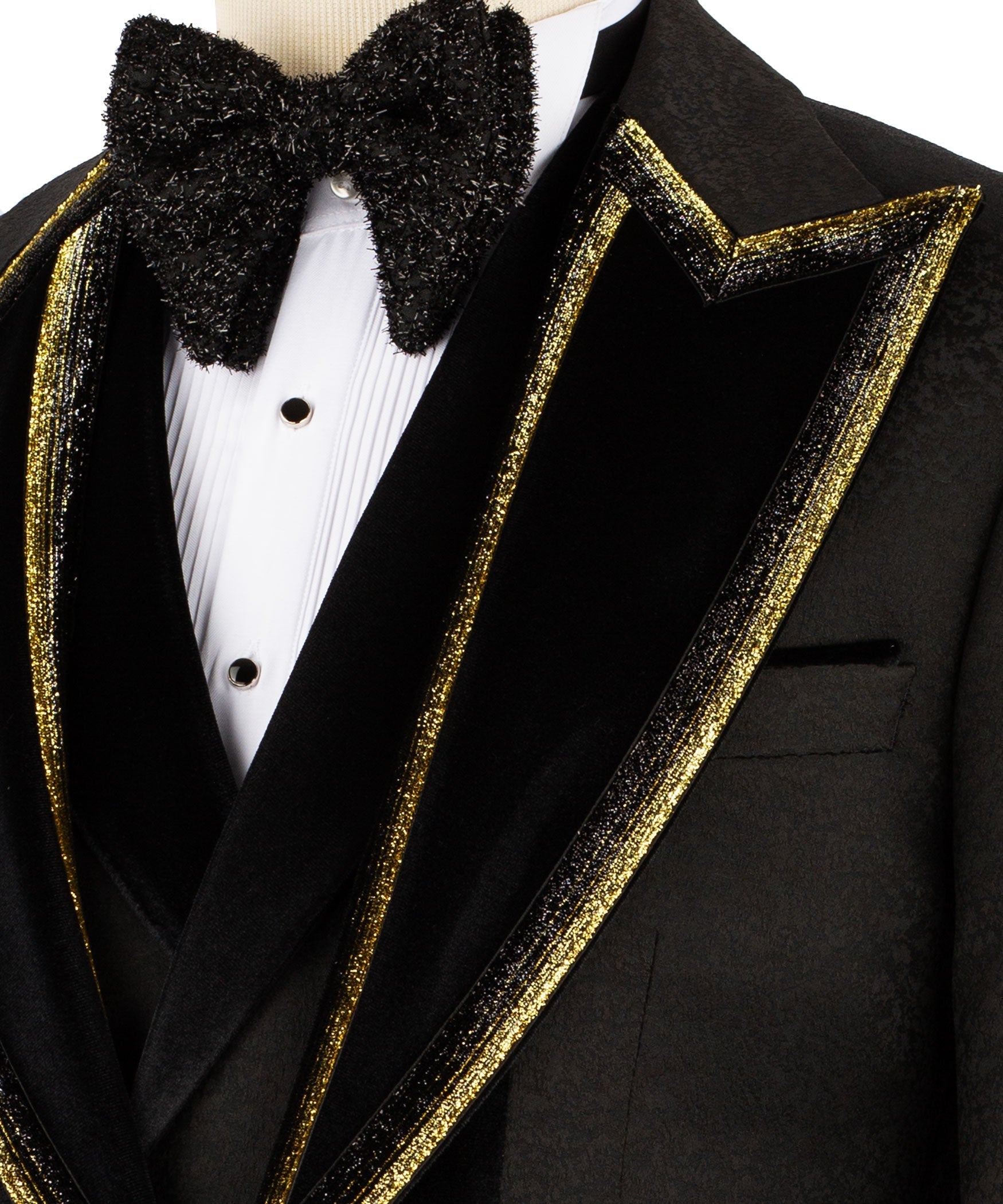 Close-up of black velvet collar, gold-embroidered lapels, and pleated white shirt