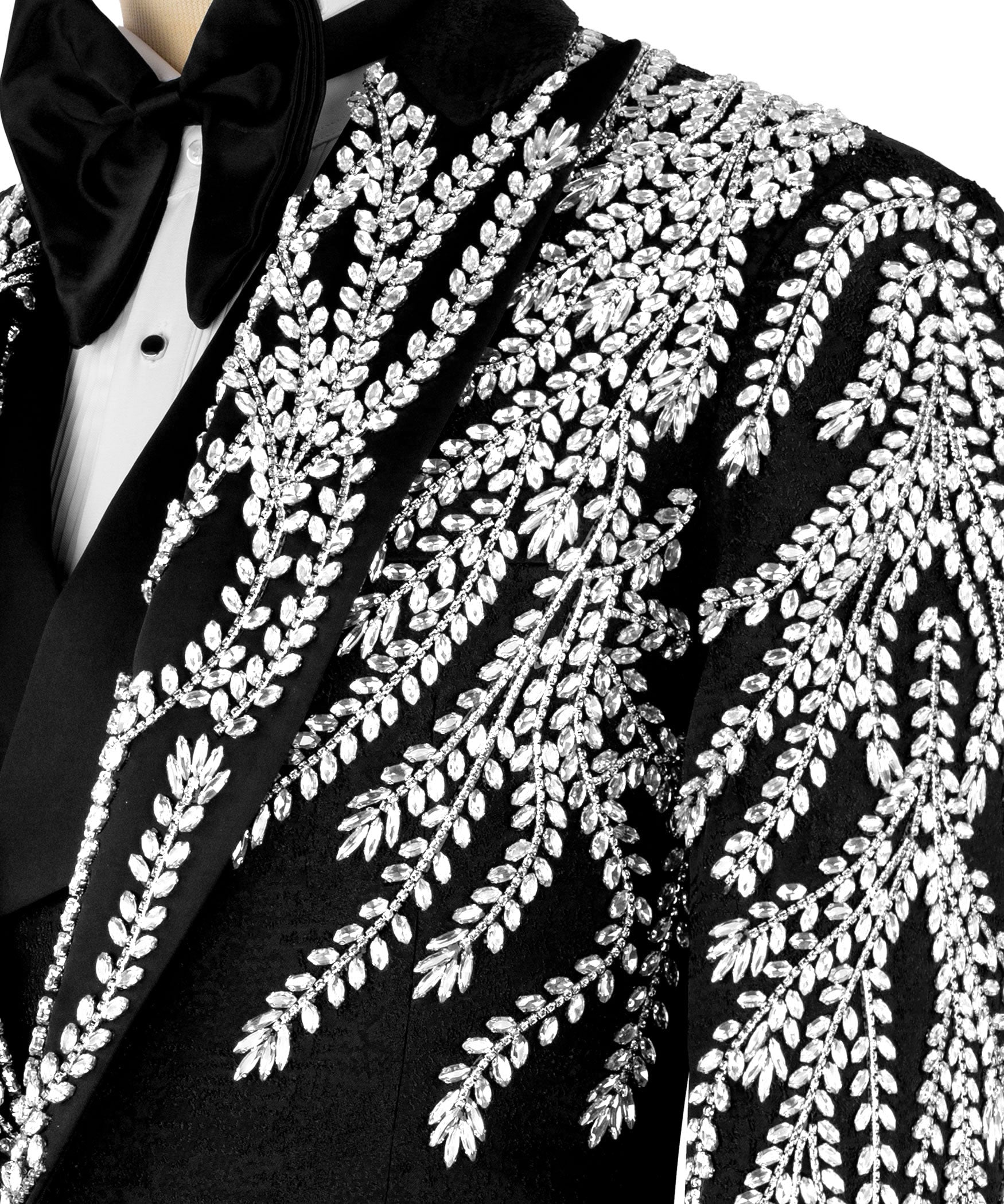 Close-up of black tuxedo jacket lapel with silver beaded leaf embroidery