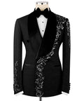 Black tuxedo jacket with velvet collar, bow tie, and silver stone floral embroidery