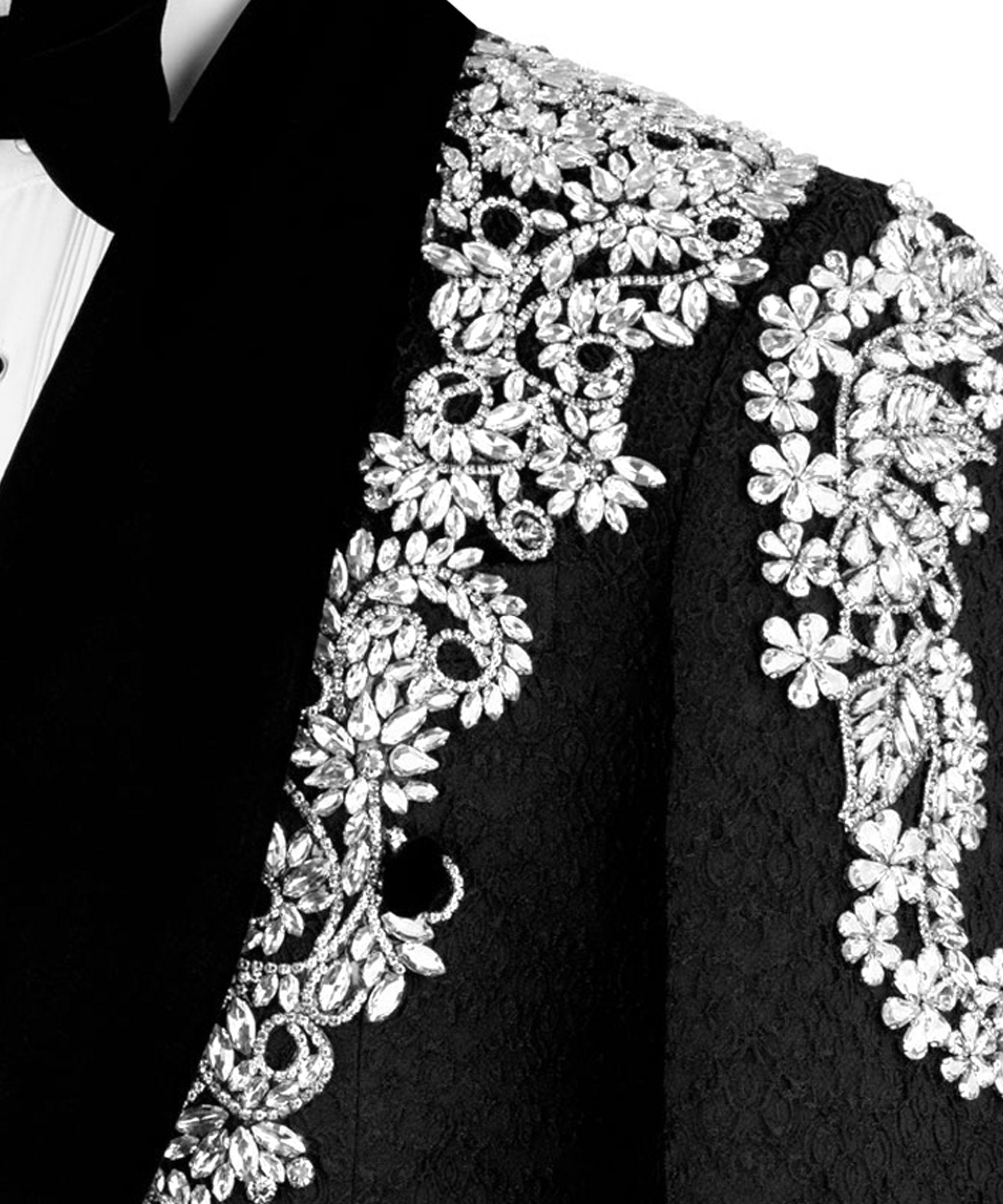 Close-up of silver-tone jeweled floral embroidery on black velvet tuxedo jacket