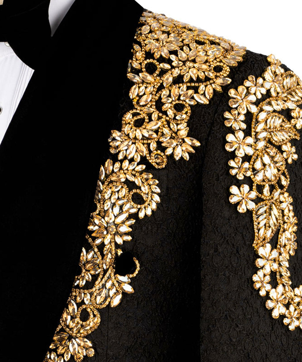 Close-up of gold floral embroidery on black velvet tuxedo jacket lapel
