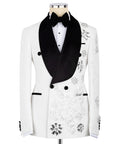 White tuxedo jacket with black satin lapels, bow tie, and sparkling floral hand-embroidery
