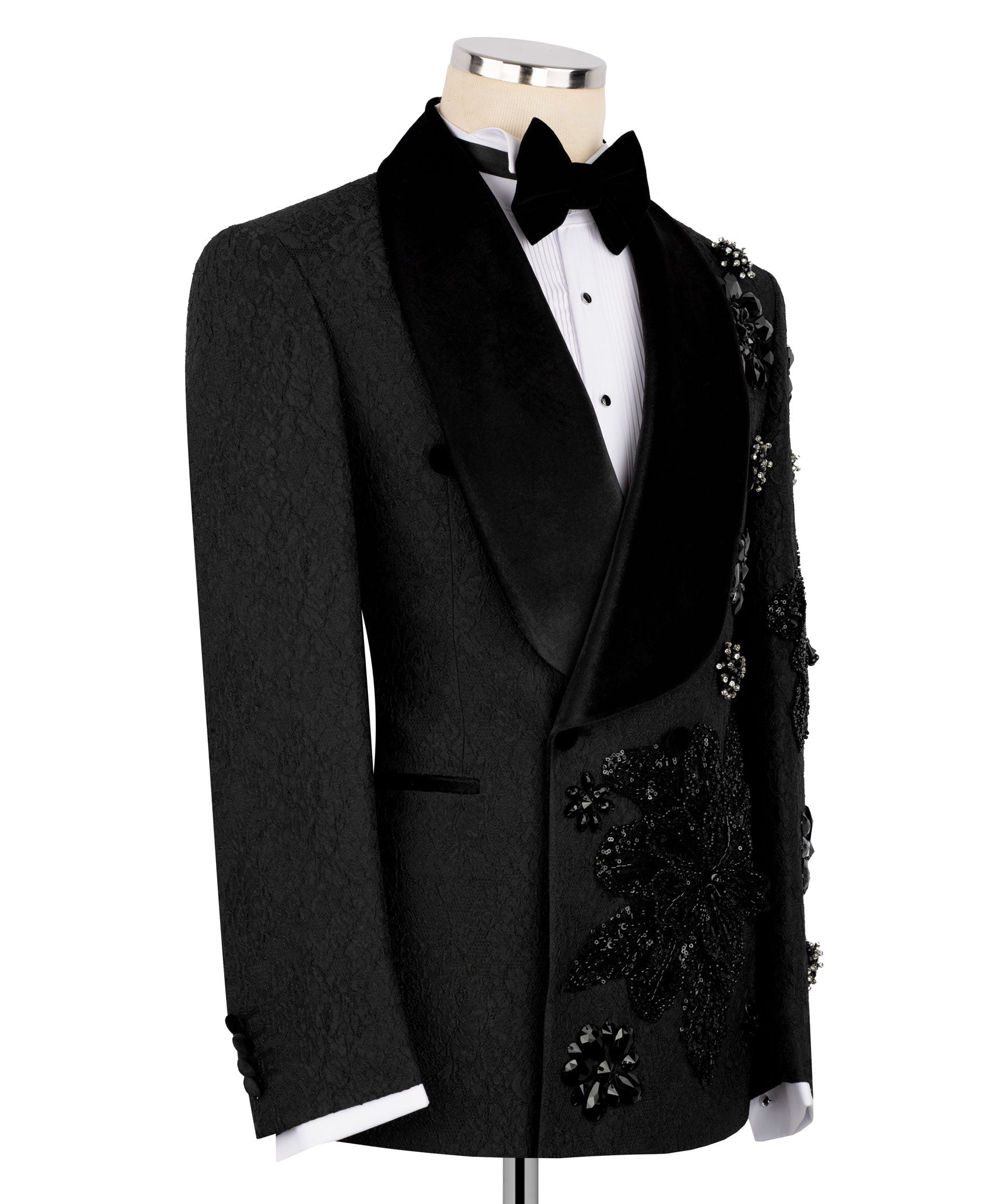 Black tuxedo jacket with satin lapels and stone-embroidered floral accents on pocket