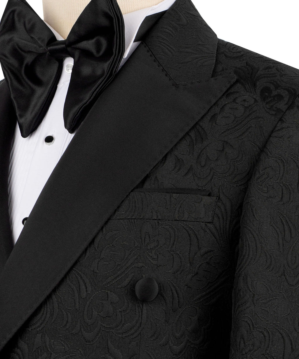 Close-up: black tuxedo jacket lapel, double buttons, patterned pocket and bow tie
