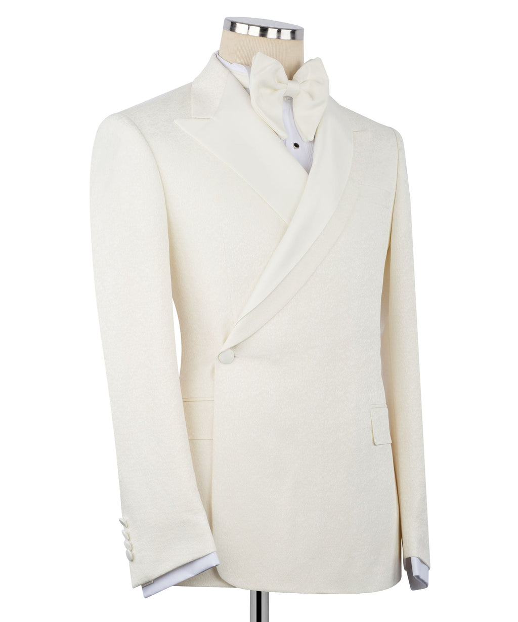 Cream tuxedo blazer with notch lapels, double-breasted front, and bow tie