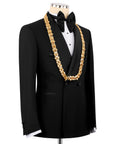 Black tuxedo jacket and vest with gold ornate chain, black bow tie and lapels