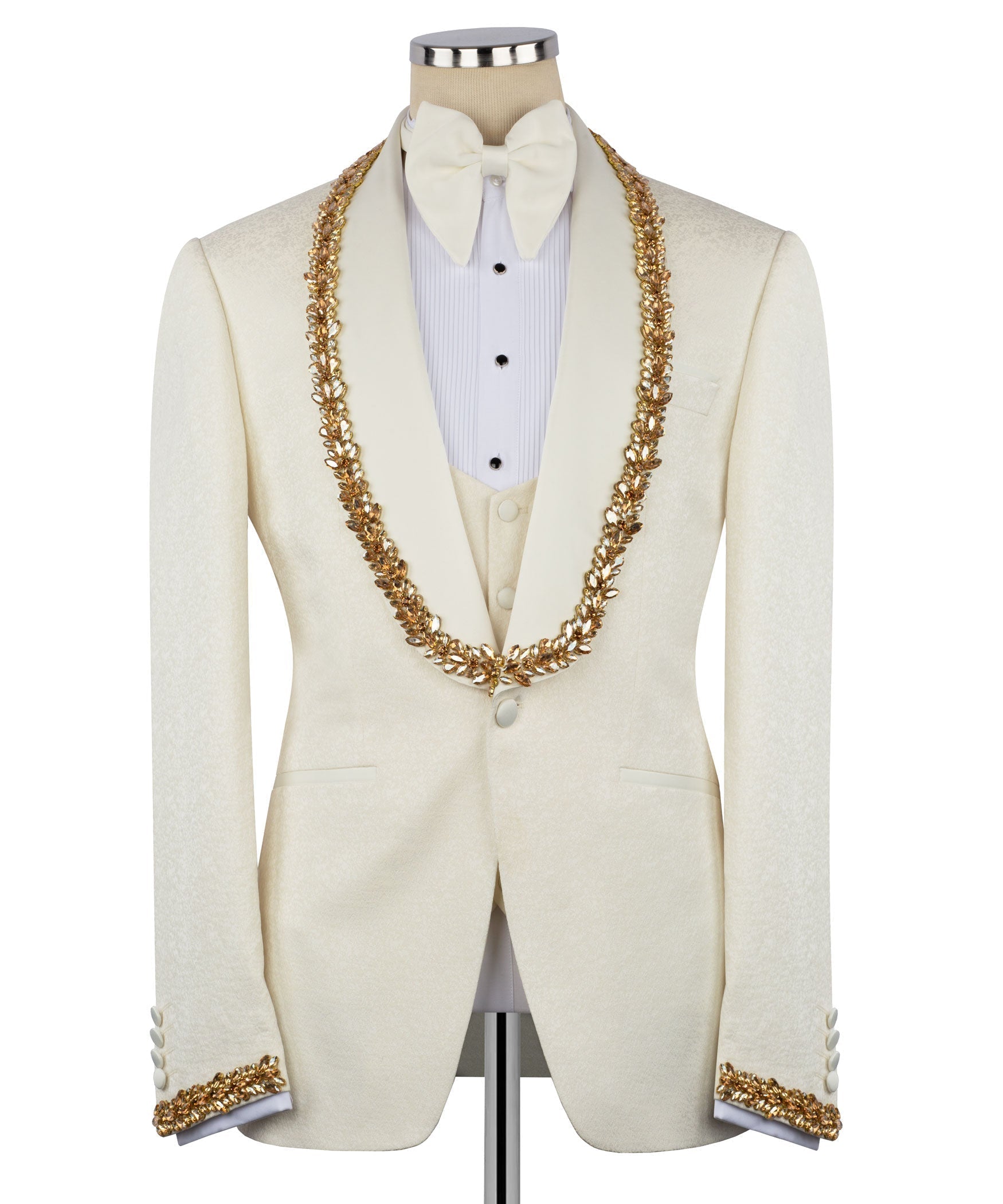 Light cream tuxedo jacket with gold stone-embellished trim, waistcoat, and bow tie