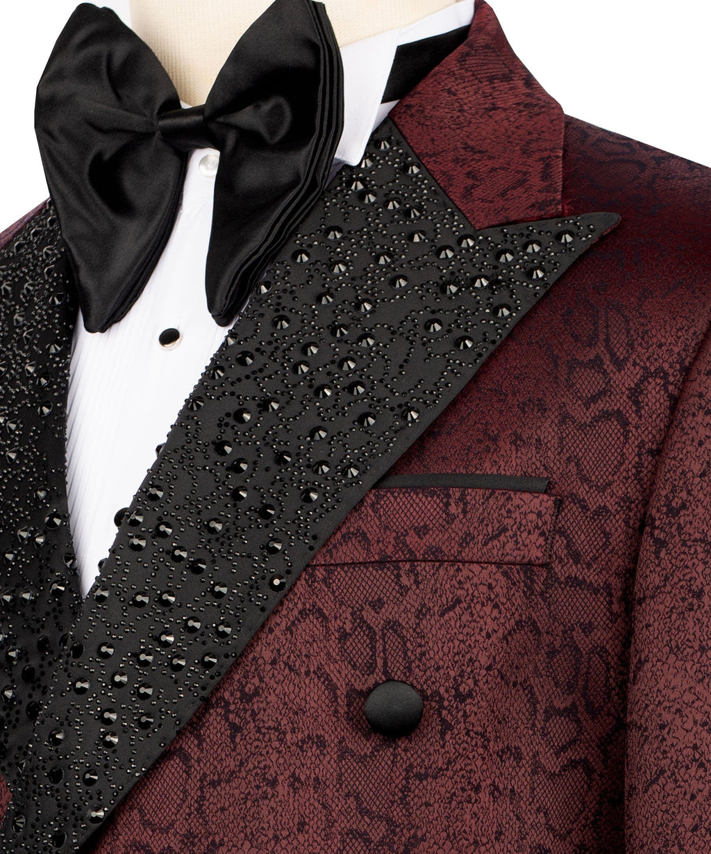 Close-up: burgundy patterned pocket and lapel with black beaded trim, satin bow tie