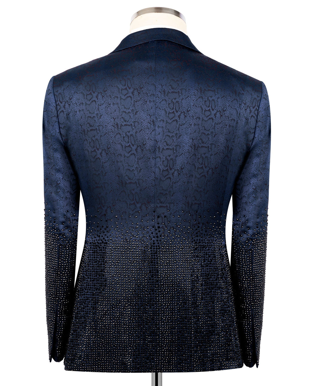 Blue tuxedo jacket back view with textured, jeweled lower panels