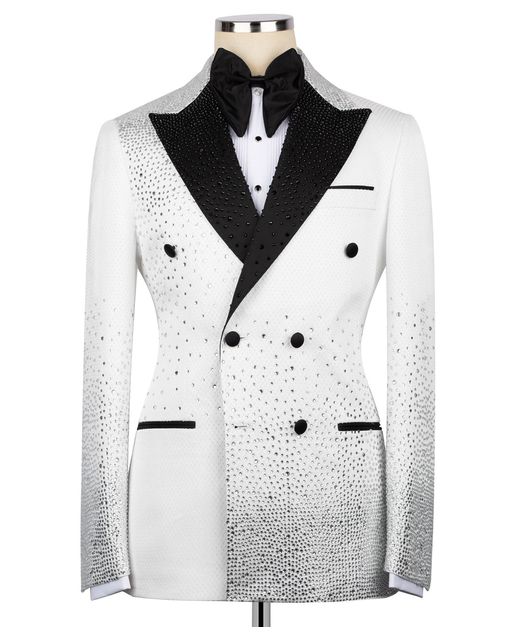 White tuxedo jacket with black satin lapels, bow tie, and double-breasted buttons