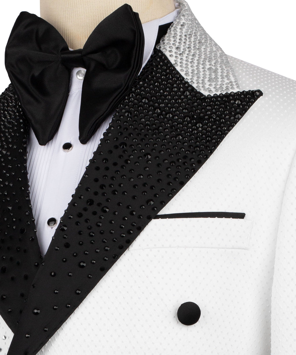 Close-up tuxedo jacket: black bow tie, black jeweled diagonal panel, white button