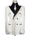 White tuxedo jacket with black lapels, bow tie, and gold stone embroidery