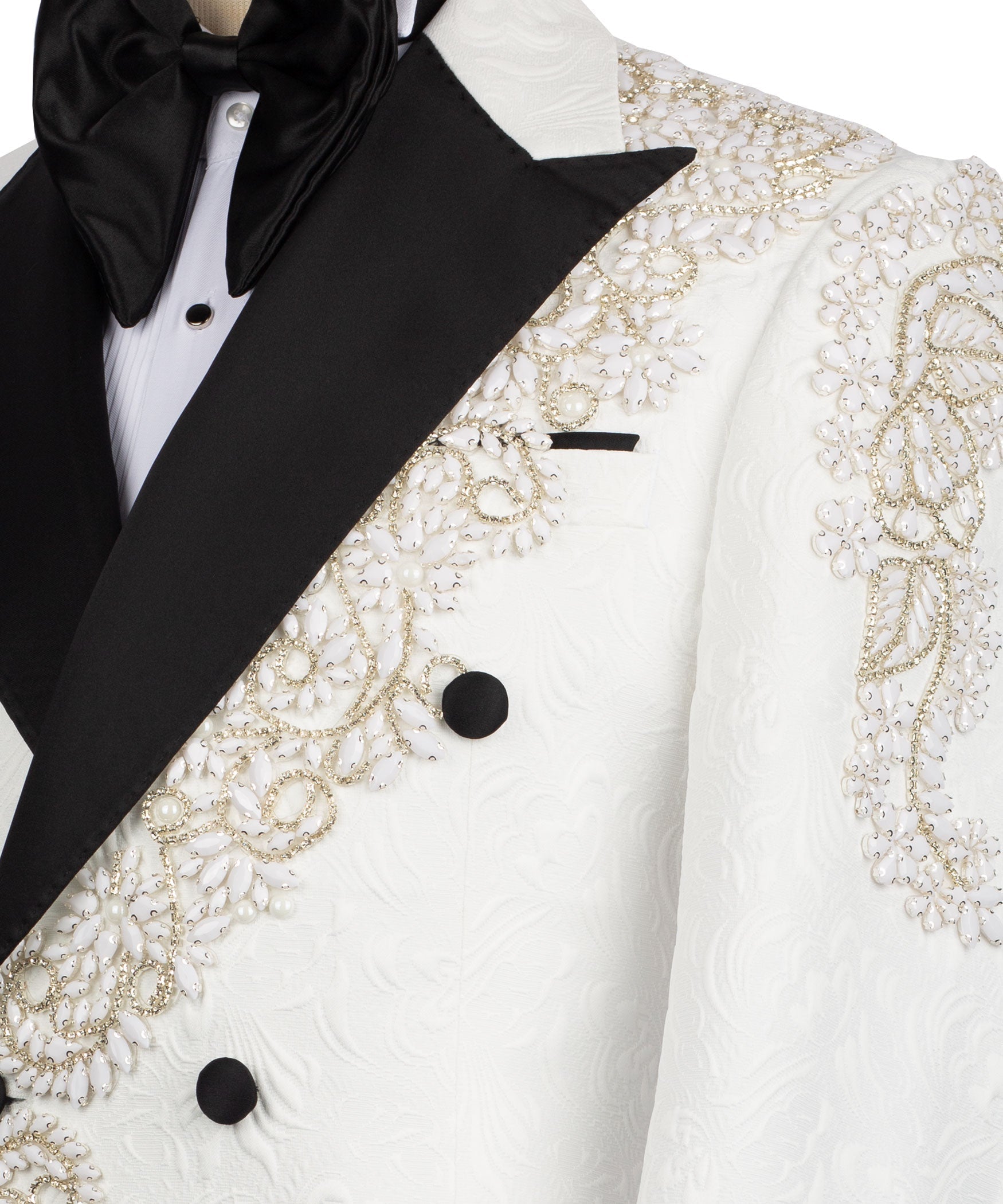 White tuxedo front close-up with gold stone embroidery and black bow tie