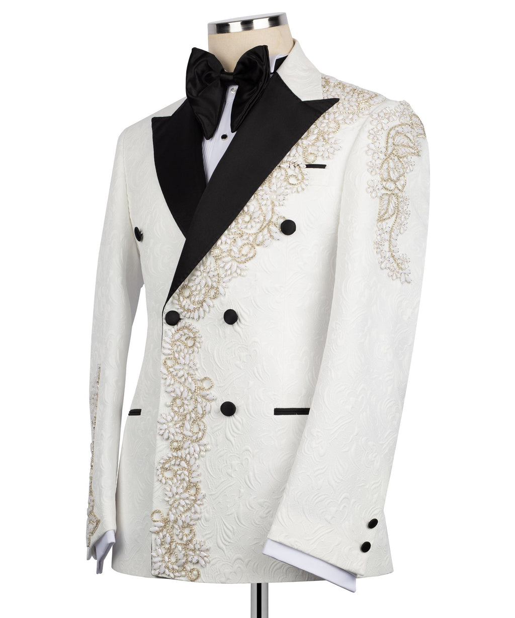 White tuxedo jacket with black bow tie, gold beadwork panels, and black buttons
