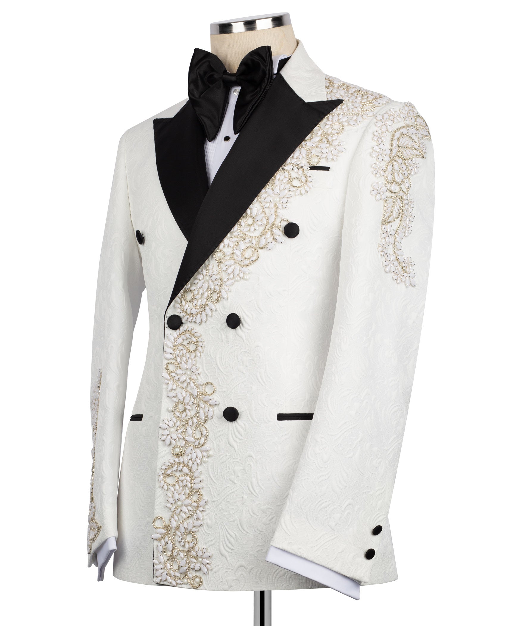 White tuxedo jacket with black bow tie, gold beadwork panels, and black buttons