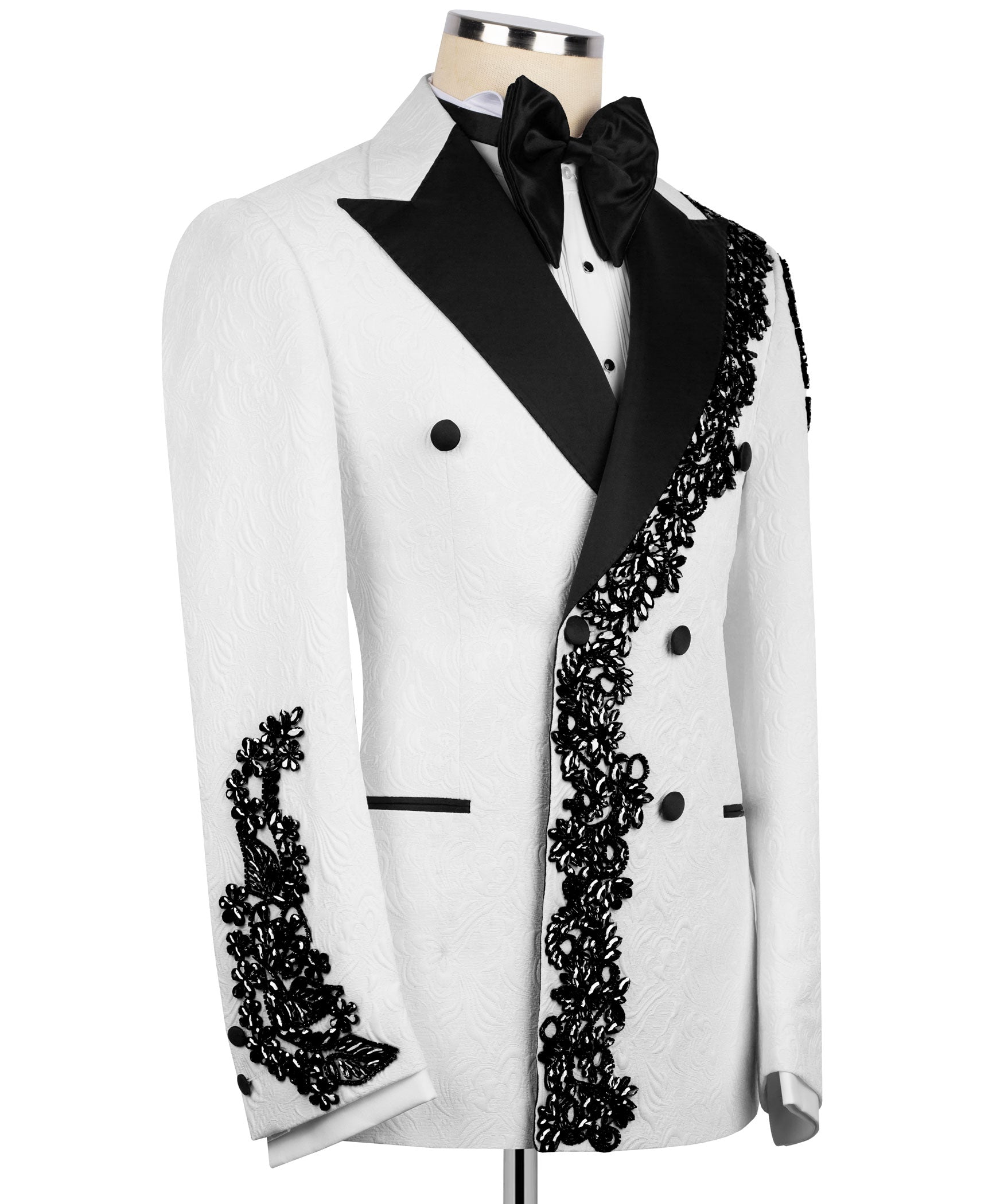 White tuxedo jacket with black lapel, diagonal accent, ornate lace trim on shoulders and cuffs