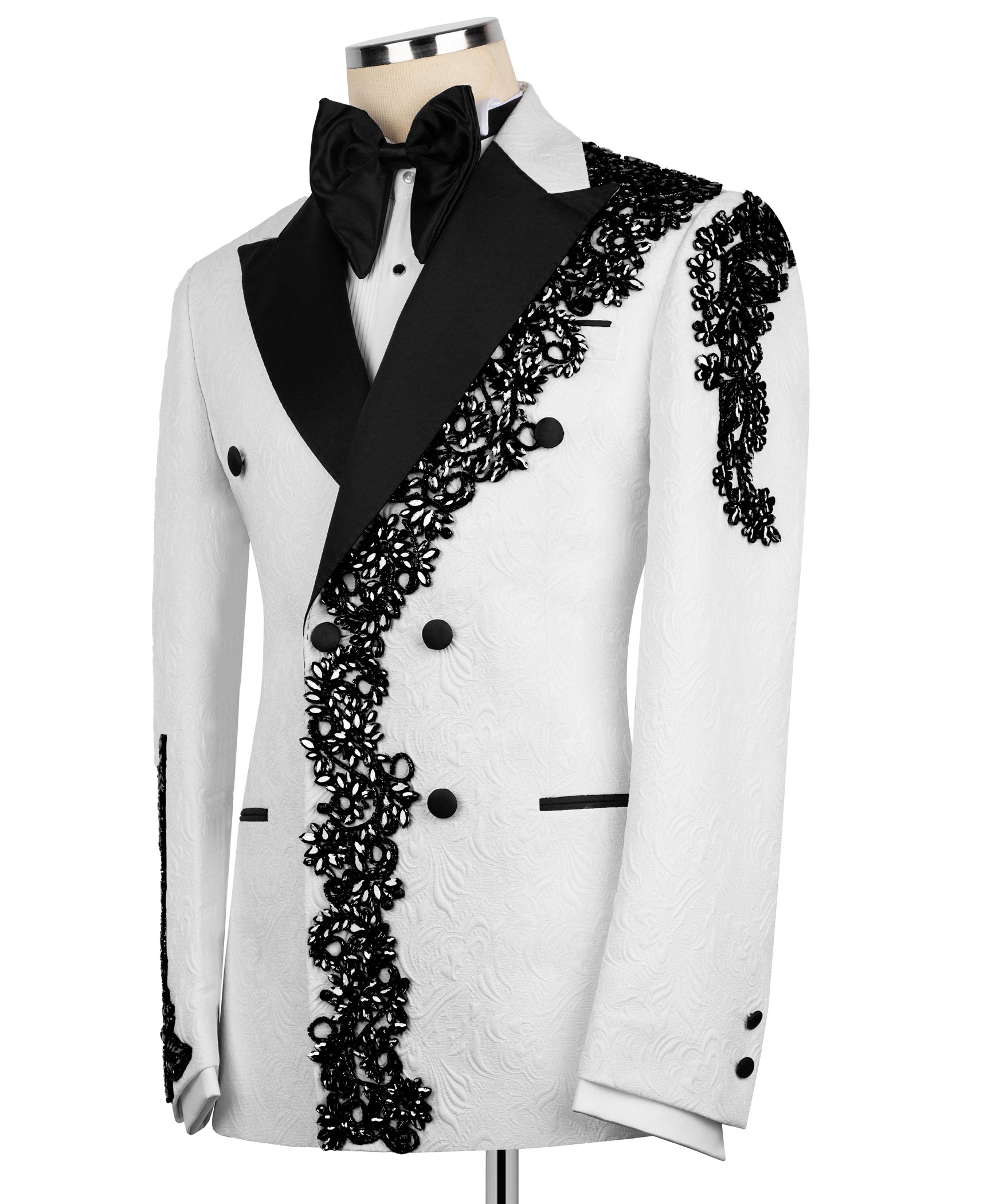 Tuxedo jacket front: black lapel and bow tie over white fabric with black buttons and lace