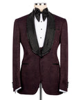 Maroon tuxedo jacket with black beaded collar trim over white shirt and black bow