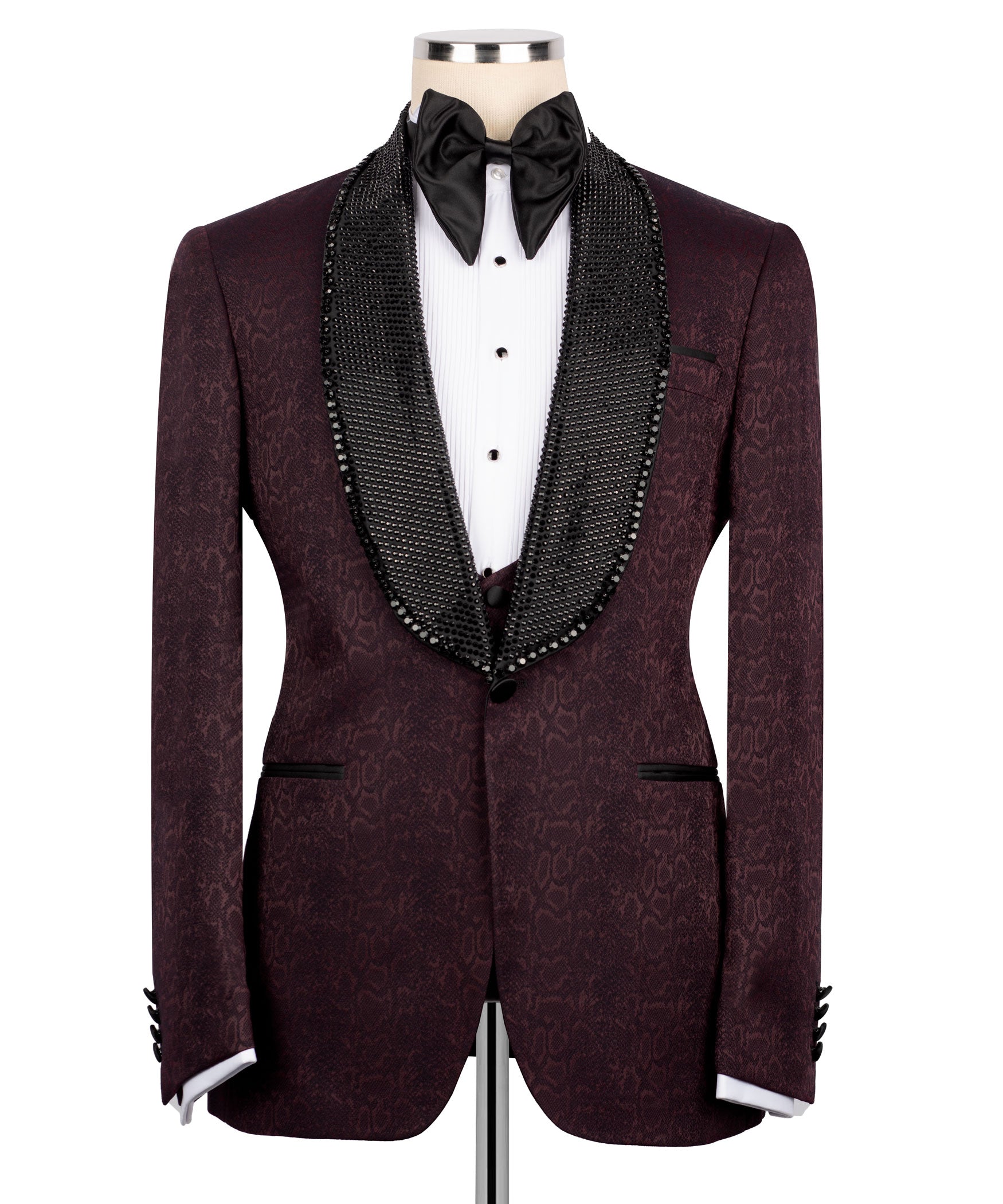 Maroon tuxedo jacket with black beaded collar trim over white shirt and black bow