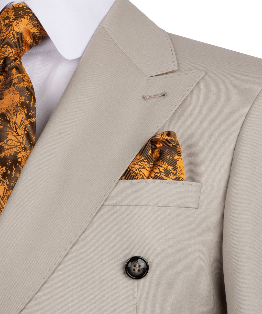 Close-up of light taupe blazer lapel, dark button, and orange patterned pocket square