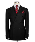 Black double-breasted suit jacket, red patterned tie and pocket square