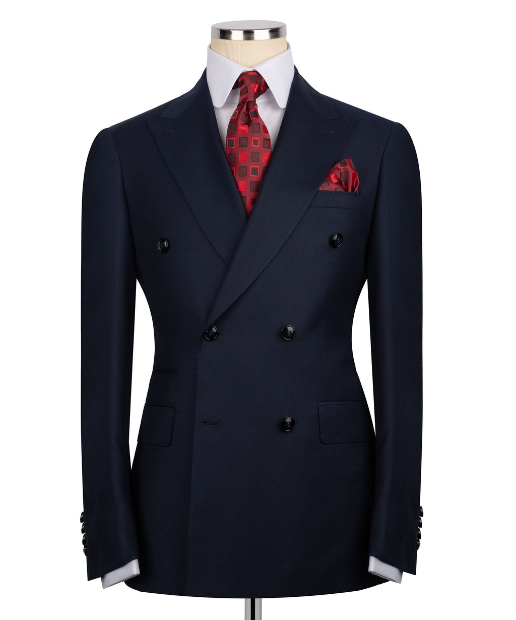 Navy double-breasted blazer with peaked lapels, red patterned tie and pocket square