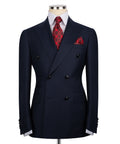 Navy double-breasted blazer with peaked lapels, red patterned tie and pocket square