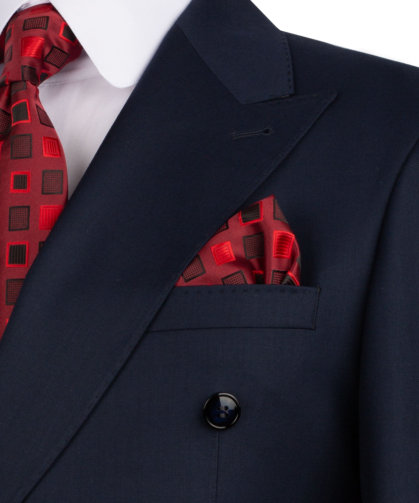 Navy blazer lapel and front button detail with red patterned pocket square