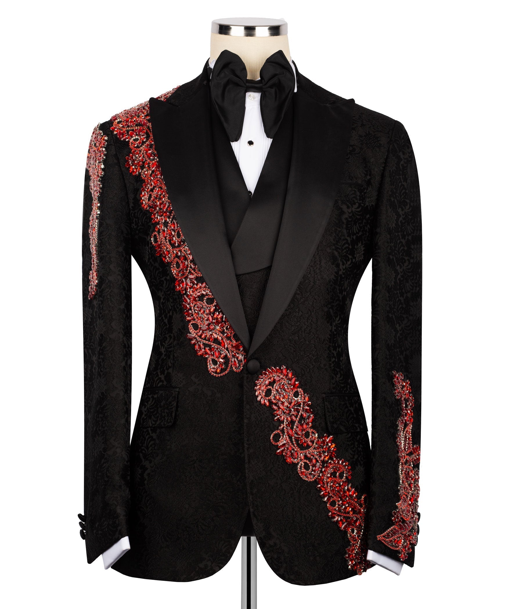 Black tuxedo jacket with red jeweled trim along shoulders, front, and sleeve cuffs