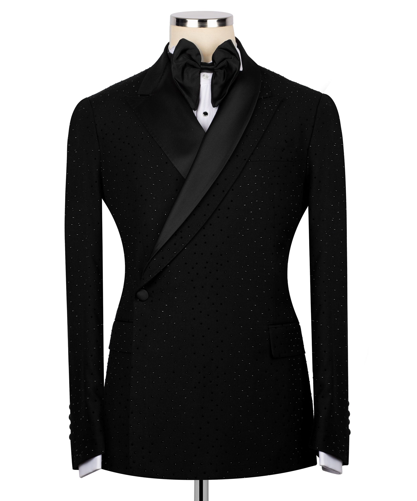 Black tuxedo jacket with stone embroidery, satin lapels, bow tie, and white shirt