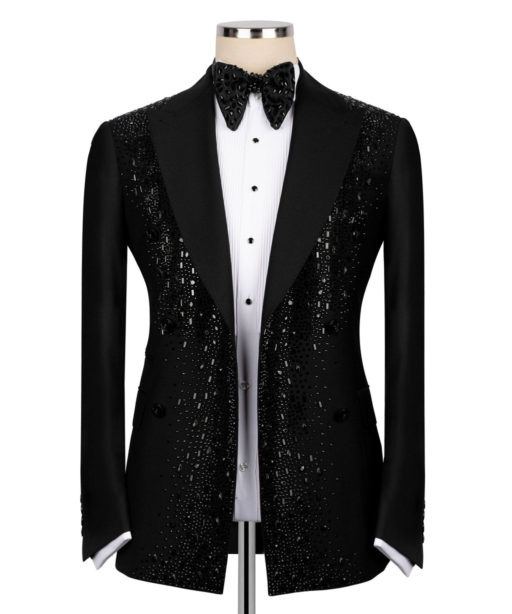 Black tuxedo blazer front with sparkling embroidery, white shirt placket and bow tie