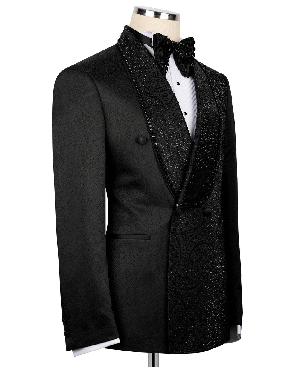 Black tuxedo jacket with ornate embroidered vest panels and black bow tie
