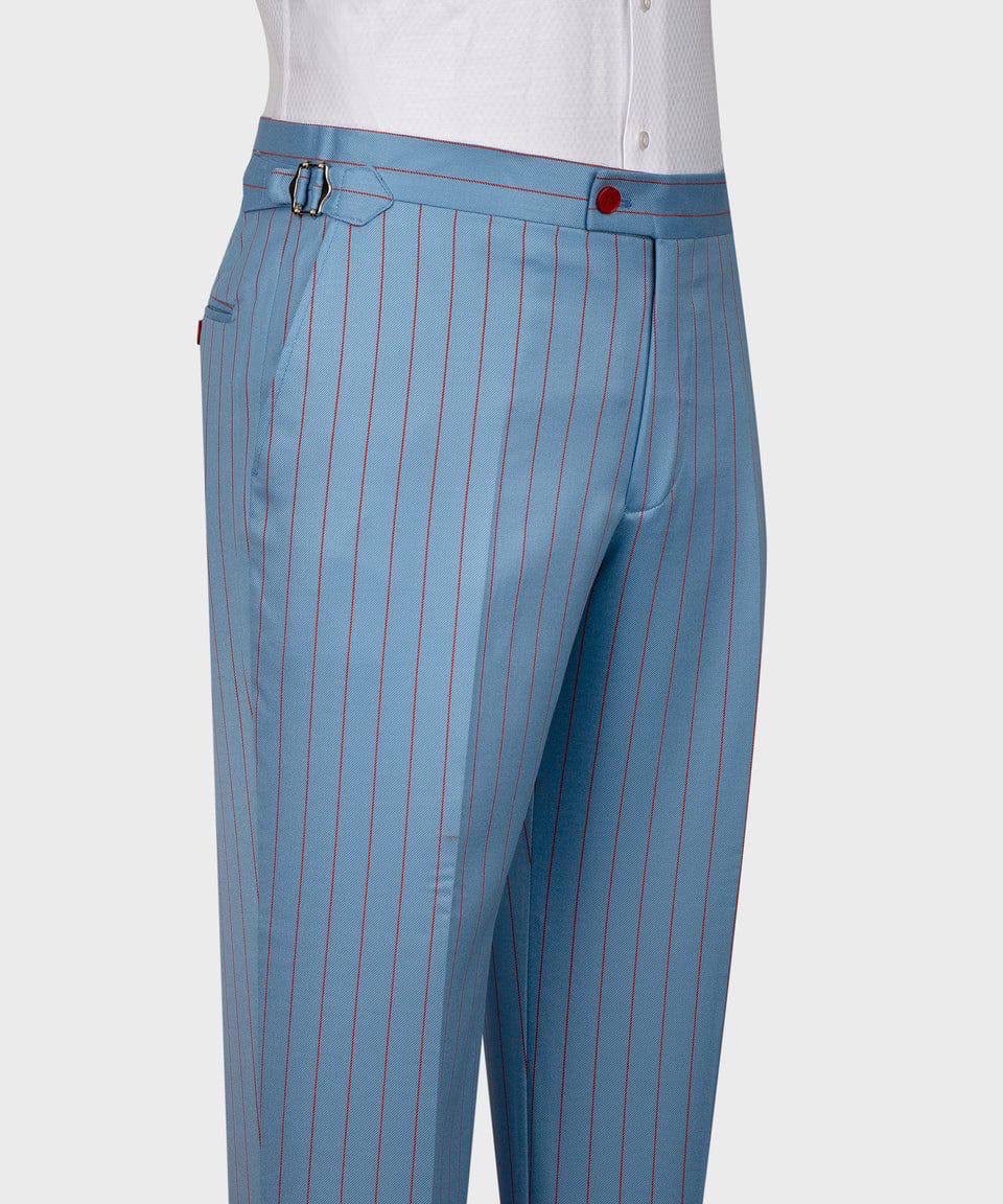 Blue pinstripe pants with a white shirt on a light gray background