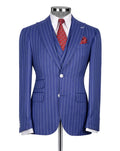 A blue pinstripe suit jacket displayed on a mannequin torso, styled with a white dress shirt, a red patterned tie, and a matching pocket square against a light gray background.
