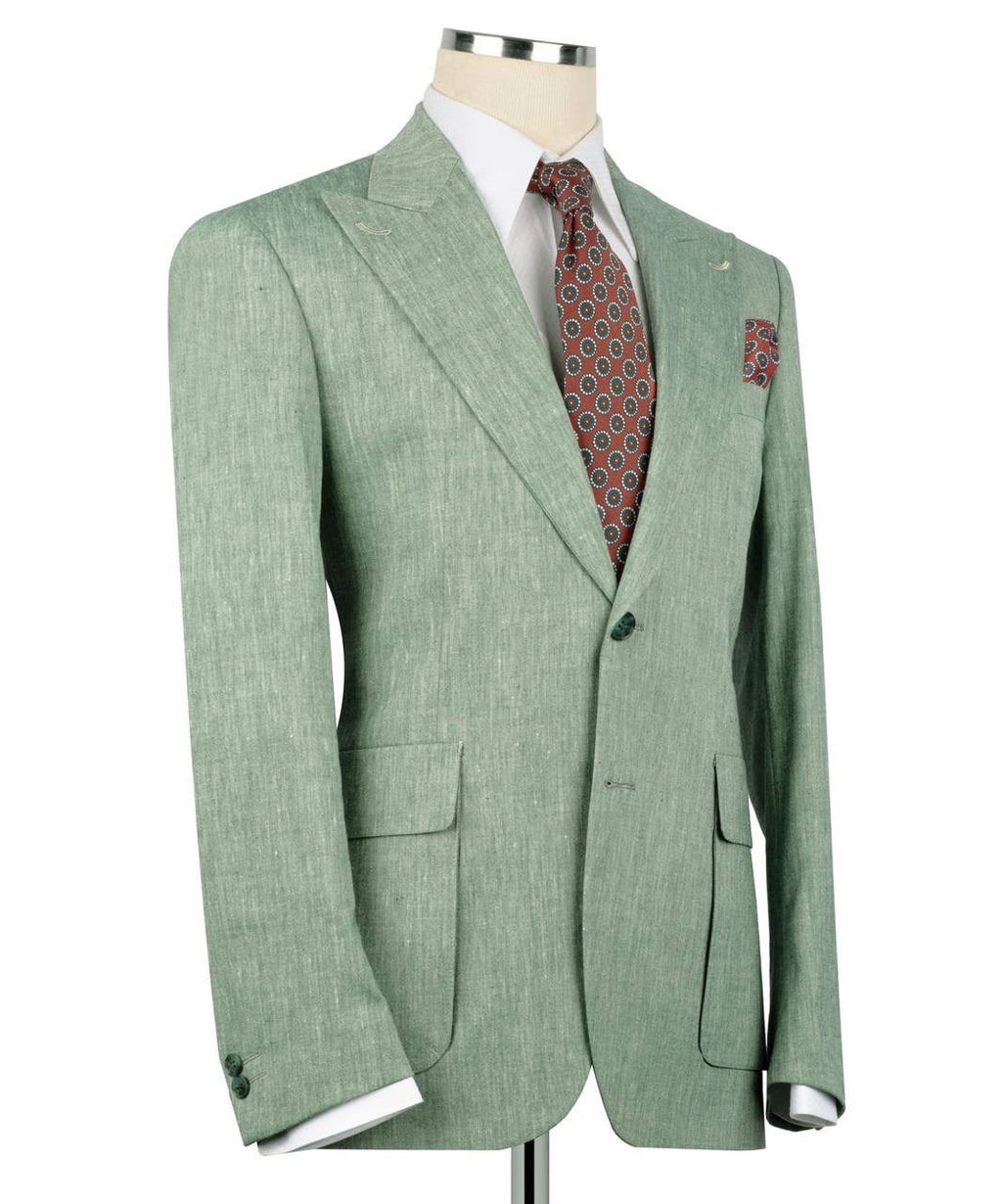 A light sage green textured suit jacket displayed on a mannequin torso, styled with a white dress shirt, a red and blue patterned tie, and a matching pocket square against a white background.