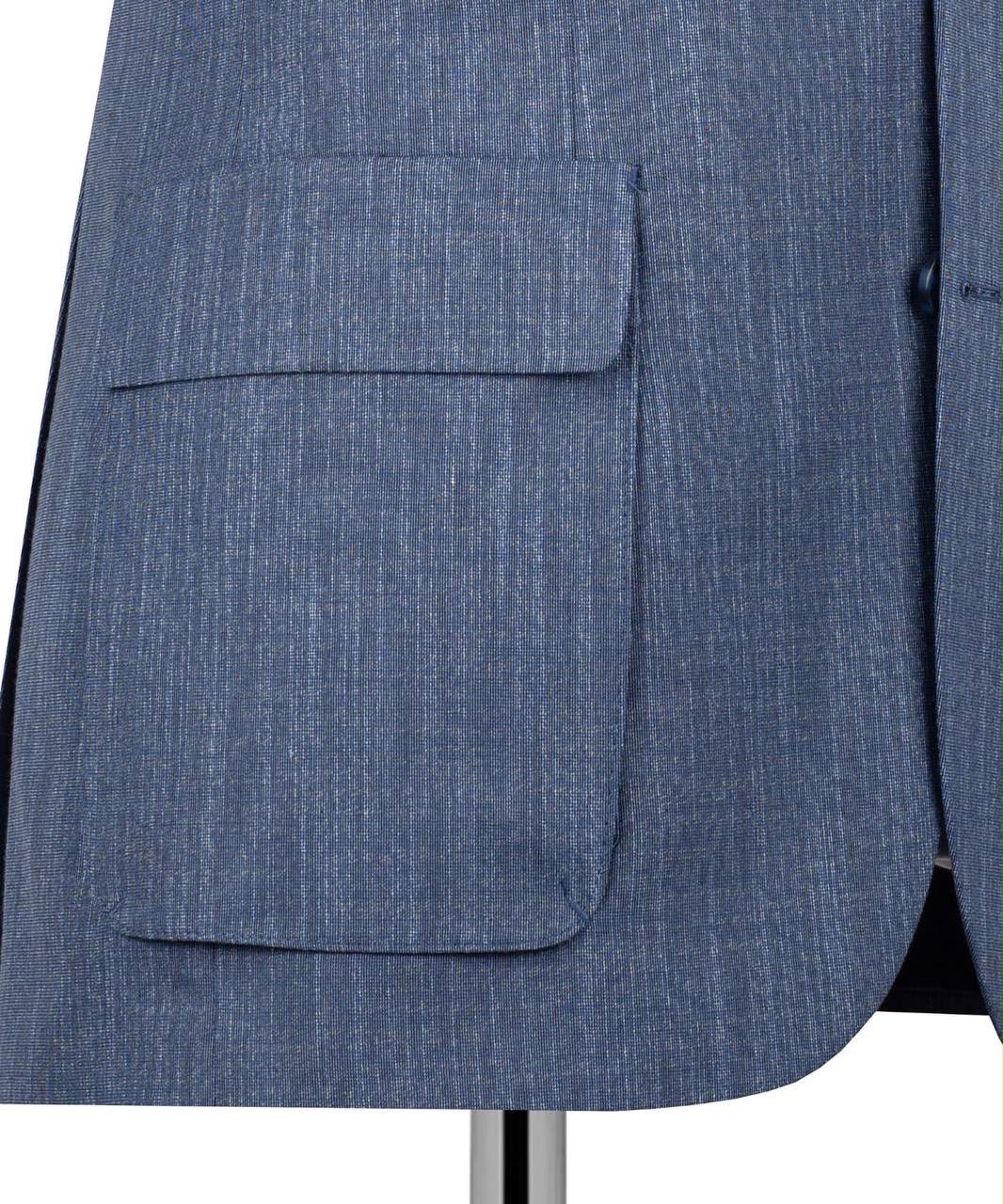 Close-up of a textured blue suit jacket with a flap pocket, shown on a mannequin against a white background.