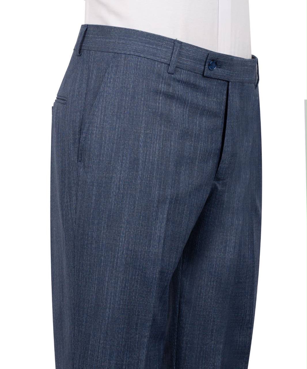 Close-up of a pair of blue textured trousers on a mannequin, showing the waistband, belt loops, front pocket, and fabric texture against a white background.