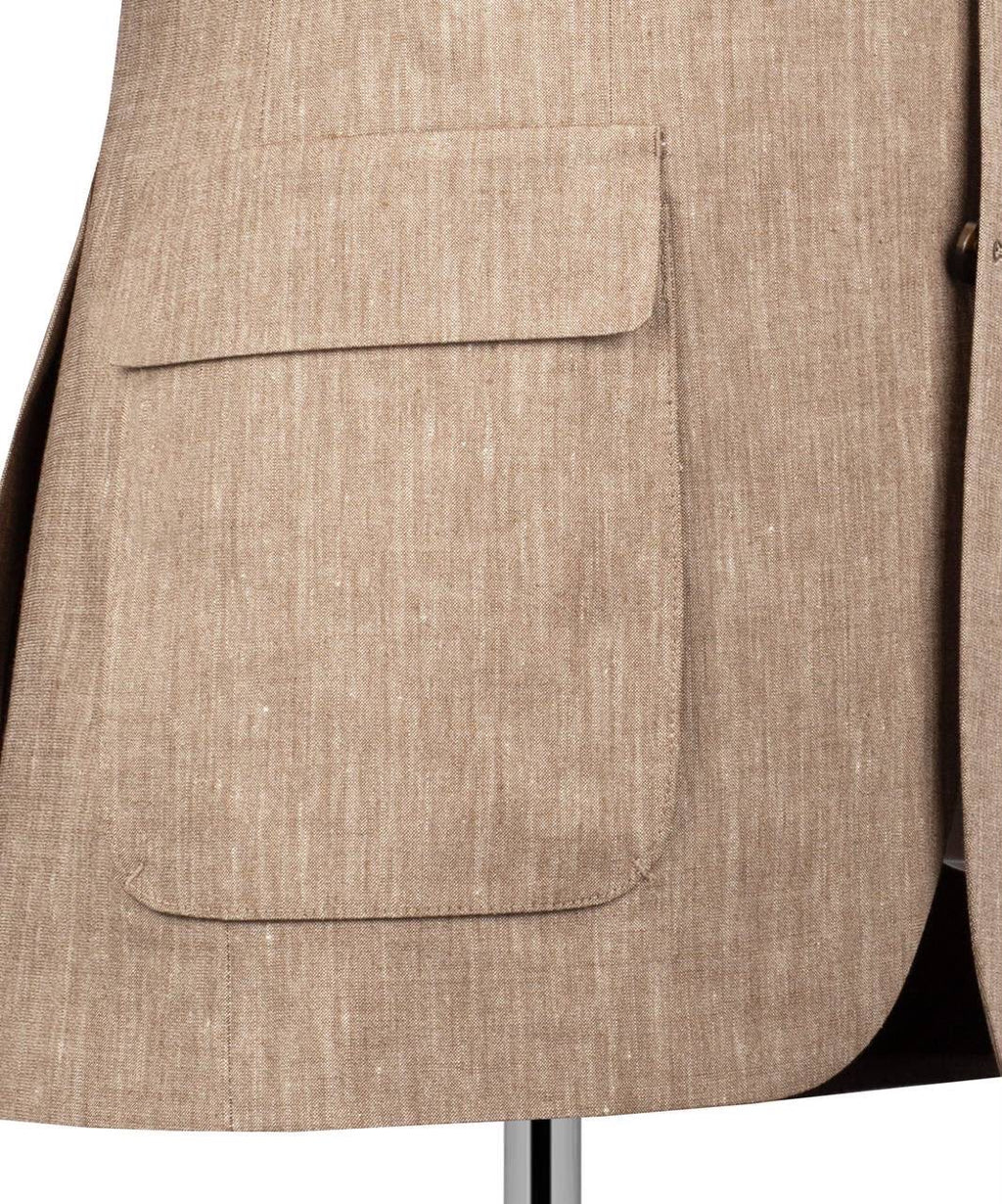 Close-up of a beige textured blazer with a pocket
