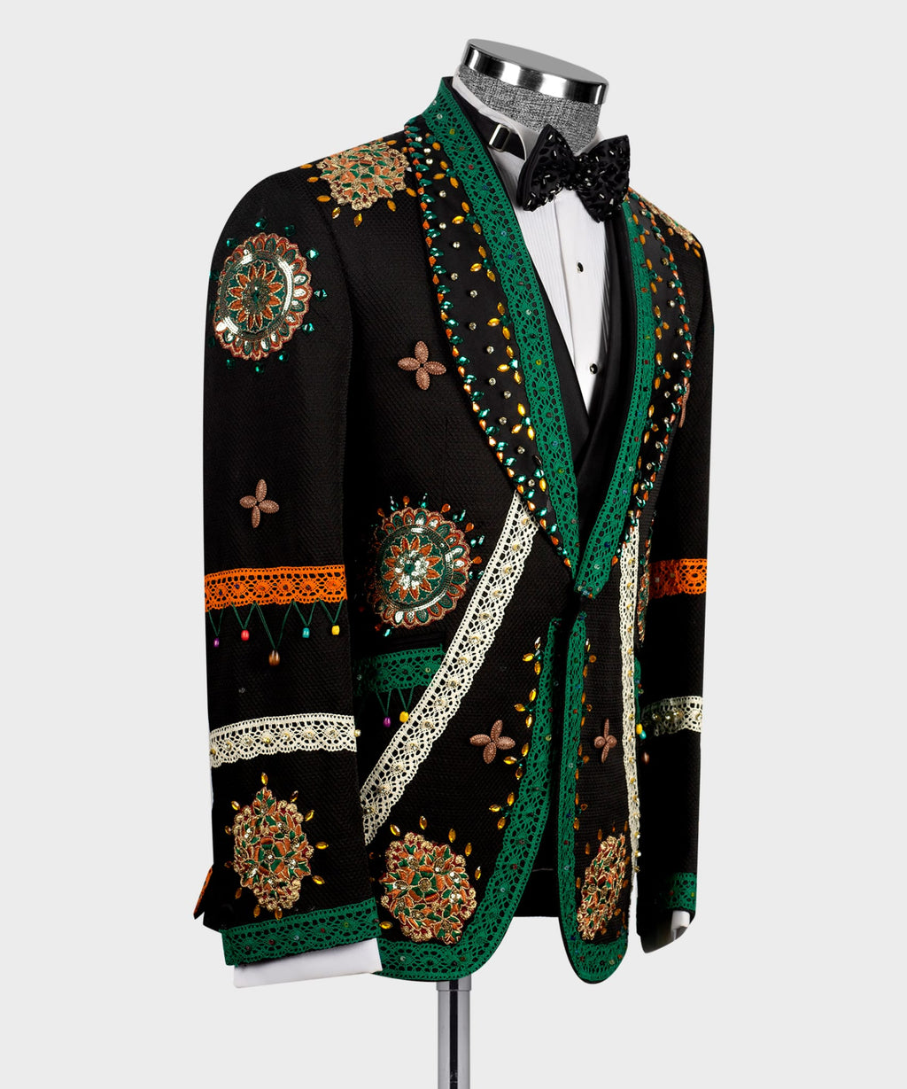 Black tuxedo jacket with green trim, butterfly motifs, and crystal-style embellishments